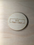 Wooden disc with logo for photo prop